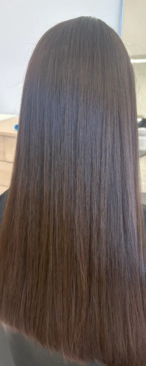 Long straight brunette hair with a smooth, glossy finish.